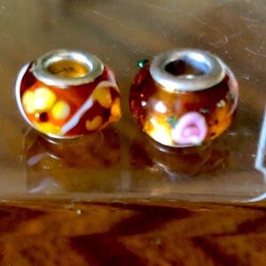 2-amber colored floral blown glass bracelet/ necklace spacer beads